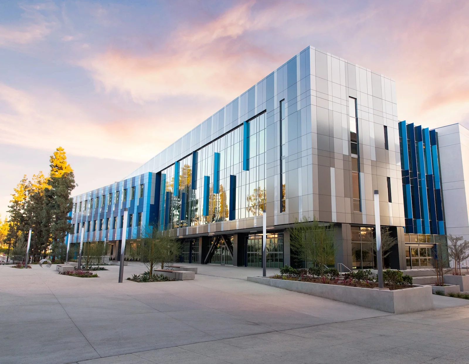 A modern commercial office building with a glass and metal-panel facade, representing the kind of professional facility Clean Vibes services.